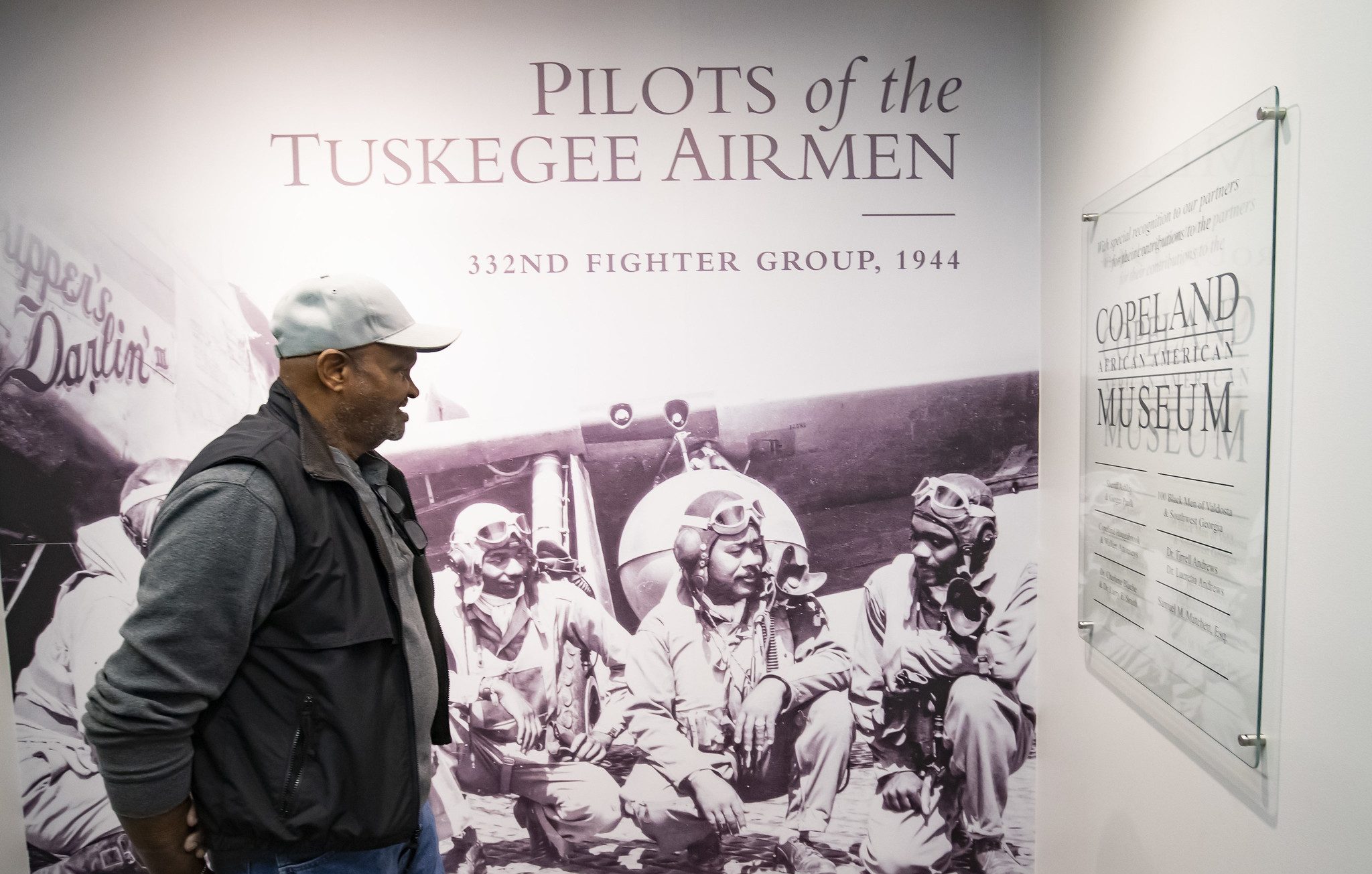 Patron of Copeland Museum viewing Tuskegee Airman display.